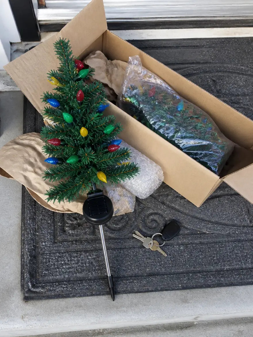 SolarNoel trees just unboxed on the porch